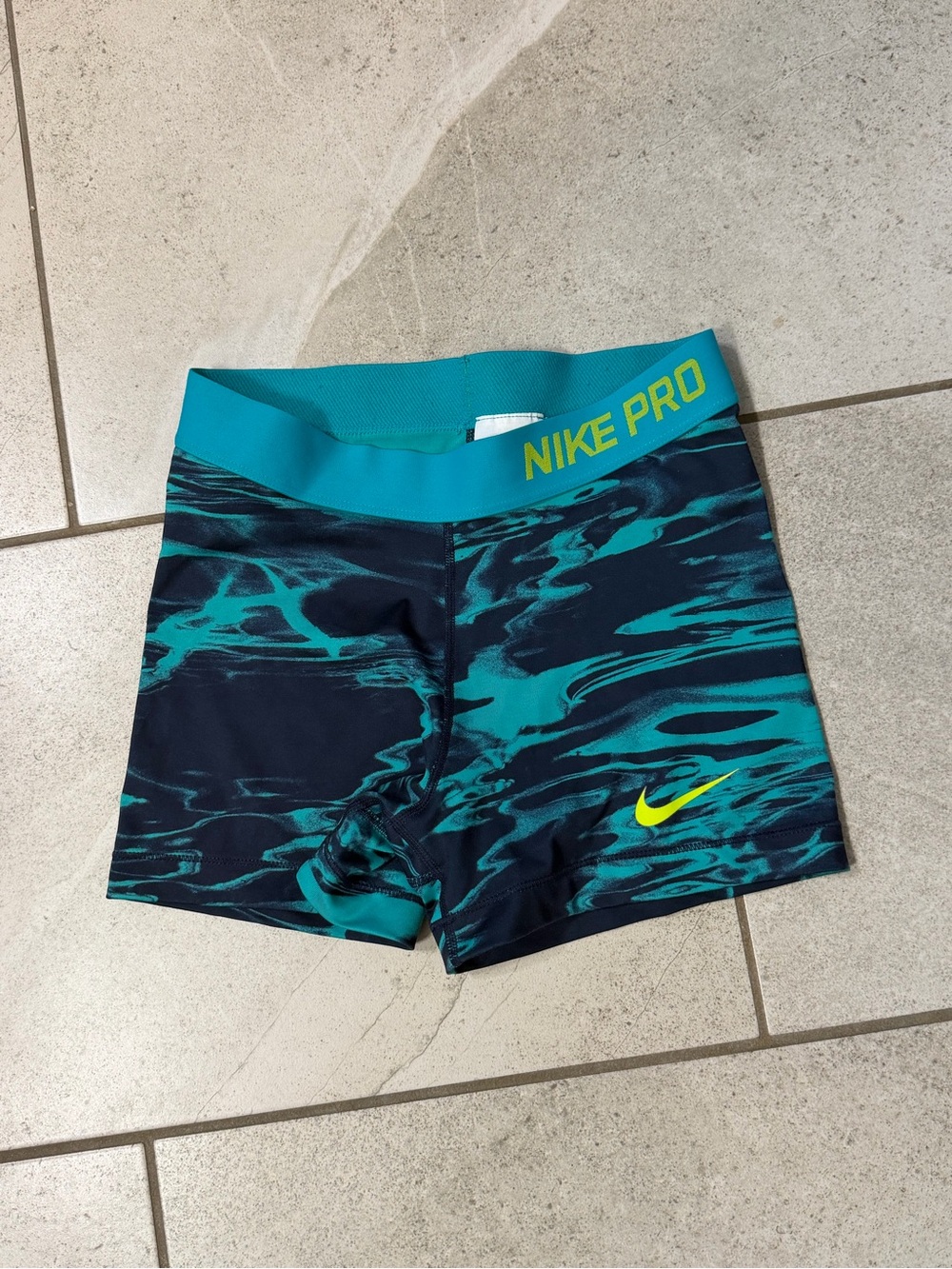 Nike Pro Dry Fit Women’s Teal and Navy Marbled Athletic Shorts with Neon Swoosh